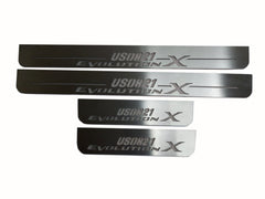 Four silver-finished door sill plates with USDM21 Evolution X lettering.