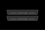 Catalog illustration of two long gray door sill plates with white Captur lettering and horizontal lines on a black background.