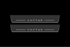 Catalog illustration of two long gray door sill plates with white Captur lettering and horizontal lines on a black background.