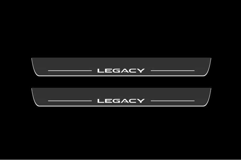Catalog illustration of two long gray door sill plates with white Legacy lettering and horizontal lines on a white background.