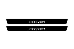 Catalog illustration of two black front door sill plates with Discovery lettering.
