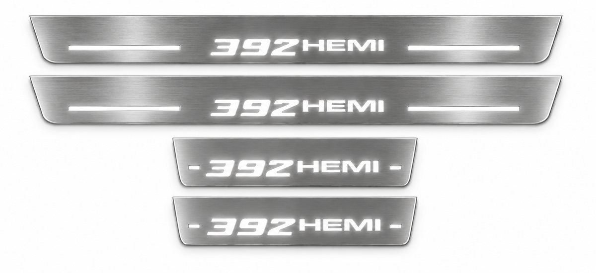 Four stainless 392 HEMI door sill plates with white LED lettering and bars, white background — product visualization
