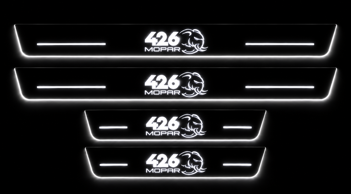 Four 426 MOPAR Hellephant door sills in darkness with white LED logos, bars and glowing lower and side edges.
