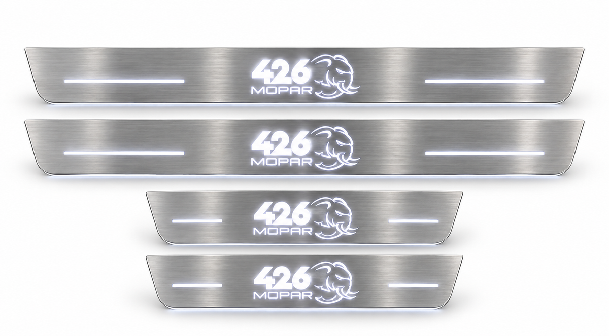 426 Mopar Hellephant brushed stainless door sill set with white LED lighting.