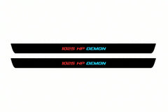 Catalogue illustration of two front black Matte PRO LED door sill plates with illuminated 1025 HP DEMON lettering for Dodge Challenger Coupe LC; dimensions are selected during manufacture.