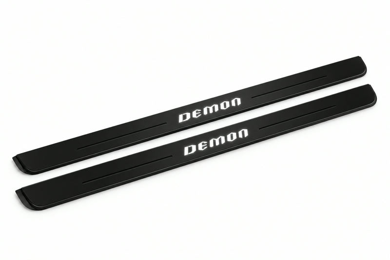 Catalogue illustration of two front black Matte PRO LED door sill plates with illuminated DEMON lettering for Dodge Challenger Coupe LC; dimensions are selected during manufacture.