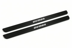 Catalogue illustration of two front black Matte PRO LED door sill plates with illuminated DEMON lettering for Dodge Challenger Coupe LC; dimensions are selected during manufacture.