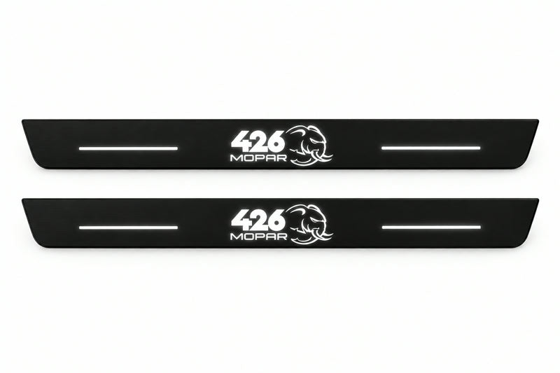 Catalogue illustration of two front black Matte PRO LED door sill plates with illuminated 426 Mopar Hellephant lettering for Dodge Charger Sedan LD; the FRONT+REAR option includes rear plates not shown; final dimensions are selected during manufacture.