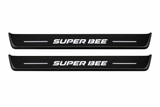 Catalogue illustration of two front black Matte PRO LED door sill plates with illuminated Super Bee lettering for Dodge Charger Sedan LD; the FRONT+REAR option includes rear plates not shown; final dimensions are selected during manufacture.