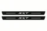 Catalogue illustration of two front black Matte PRO LED door sill plates with illuminated SXT lettering for Dodge Charger Sedan LD; the FRONT+REAR option includes rear plates not shown; final dimensions are selected during manufacture.