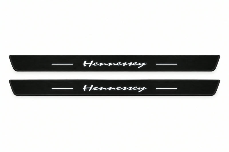 Catalogue illustration of two front black Matte PRO LED door sill plates with illuminated Hennessey lettering for Dodge Durango III; dimensions are selected during manufacture.