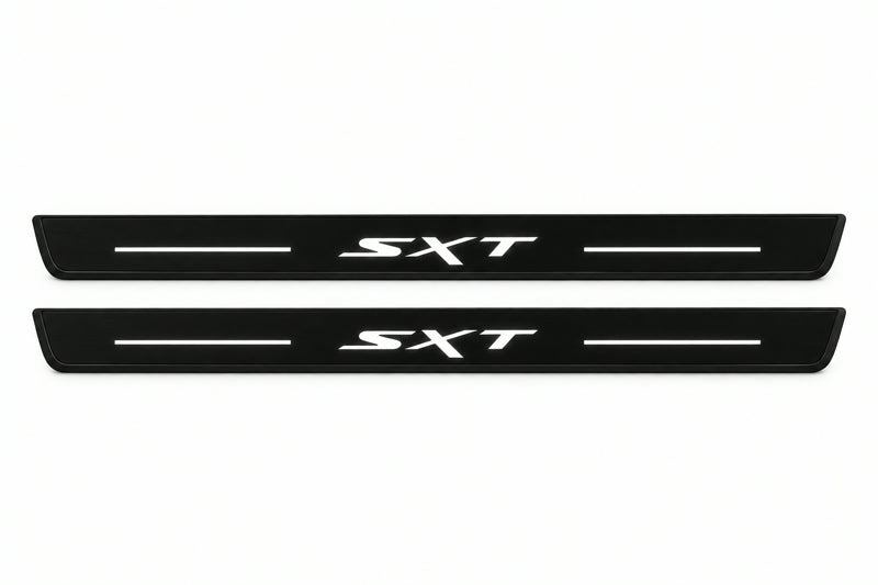 Catalogue illustration of two front black Matte PRO LED door sill plates with illuminated SXT lettering for Dodge Durango III; dimensions are selected during manufacture.