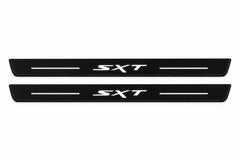 Catalogue illustration of two front black Matte PRO LED door sill plates with illuminated SXT lettering for Dodge Durango III; dimensions are selected during manufacture.