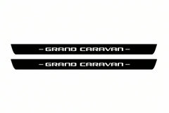 Catalogue illustration of two front black Matte PRO LED door sill plates with illuminated Grand Caravan lettering for Dodge Grand Caravan; dimensions are selected during manufacture.