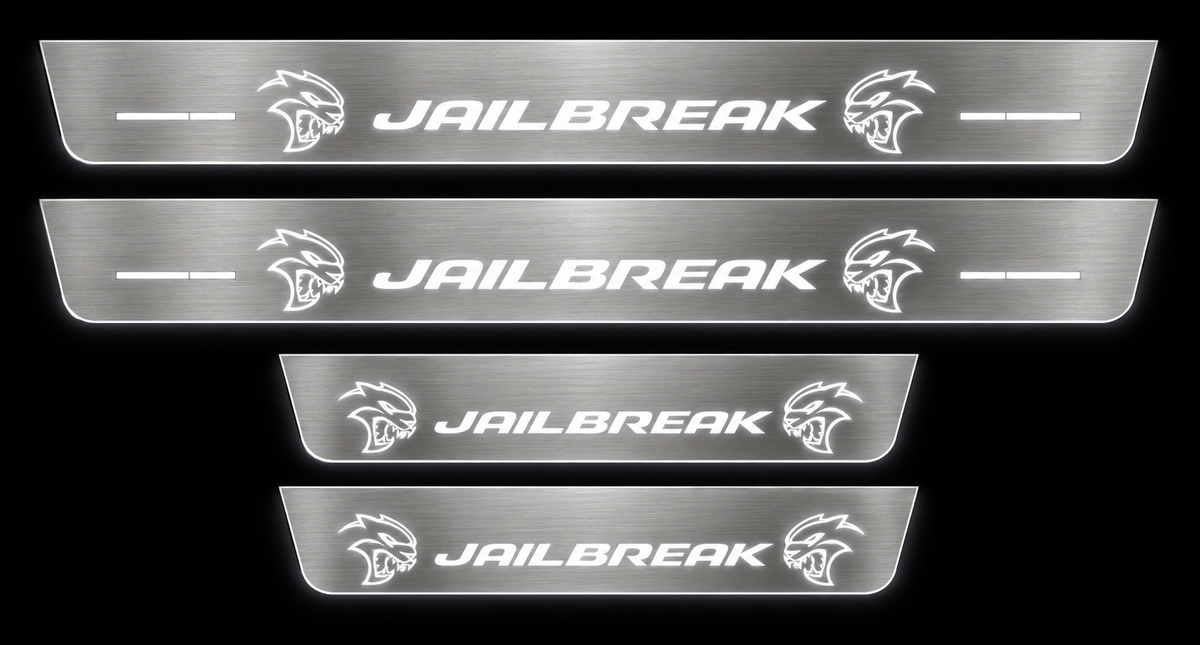 Jailbreak brushed stainless LED door sill set, white illumination, dark background.