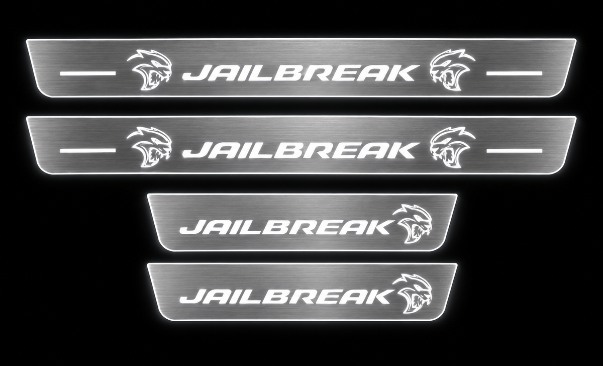 Jailbreak brushed stainless LED door sill set, white illumination, dark background.