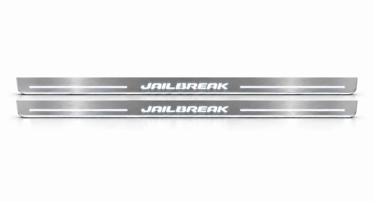 Slim stainless Jailbreak door sill pair with white LED, white background.