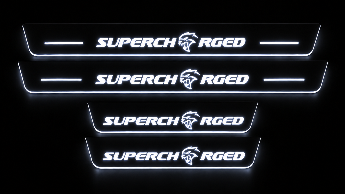 Four Supercharged Hellcat door sills at night with white illuminated lettering, light bars and side edges.