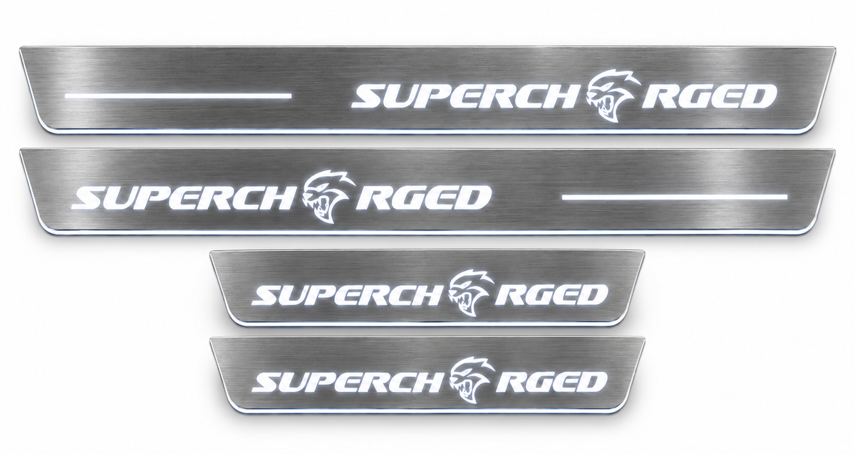 Brushed stainless Supercharged door sills with offset lettering and white LED, white background.