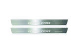 Two long silver-finished door sill plates with Eclipse Cross lettering on a light background, straight-on view.