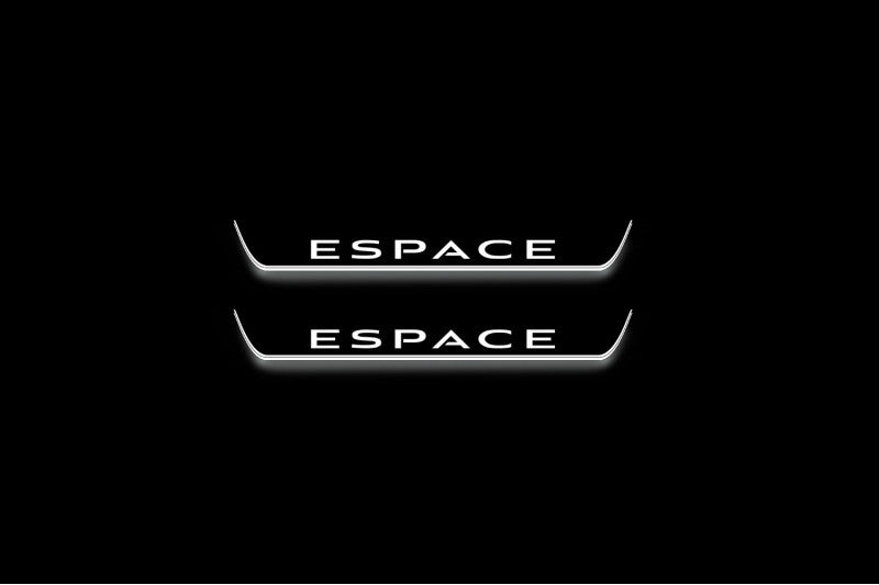 Two short door sill plates with Espace lettering and edges illuminated in white, straight-on view on a dark background.