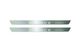 Two long silver-finished door sill plates with Espace lettering on a light background, straight-on view.