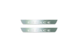 Two short silver-finished door sill plates with Espace lettering on a light background, straight-on view.