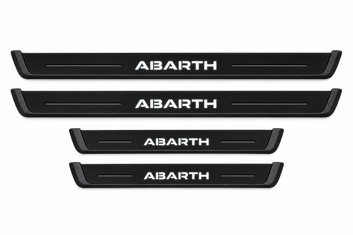 Catalogue illustration: FRONT only — two black Matte PRO front plates with ABARTH lettering illuminated on top. Rear plates offered in FRONT+REAR are not pictured; vehicle-specific dimensions are not depicted.