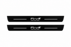 Catalogue illustration of two front black Matte PRO LED door sill plates with illuminated 500X lettering for Fiat 500X 334; the FRONT+REAR option includes rear plates not shown; final dimensions are selected during manufacture.