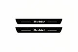 Catalogue illustration of two front black Matte PRO LED door sill plates with illuminated Doblo lettering for Fiat Doblo Van 223; dimensions are selected during manufacture.