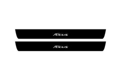 Catalog illustration of two black front door sill plates with Focus lettering.