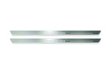 Two long silver-finished door sill plates with Forester lettering on a light background, straight-on view.