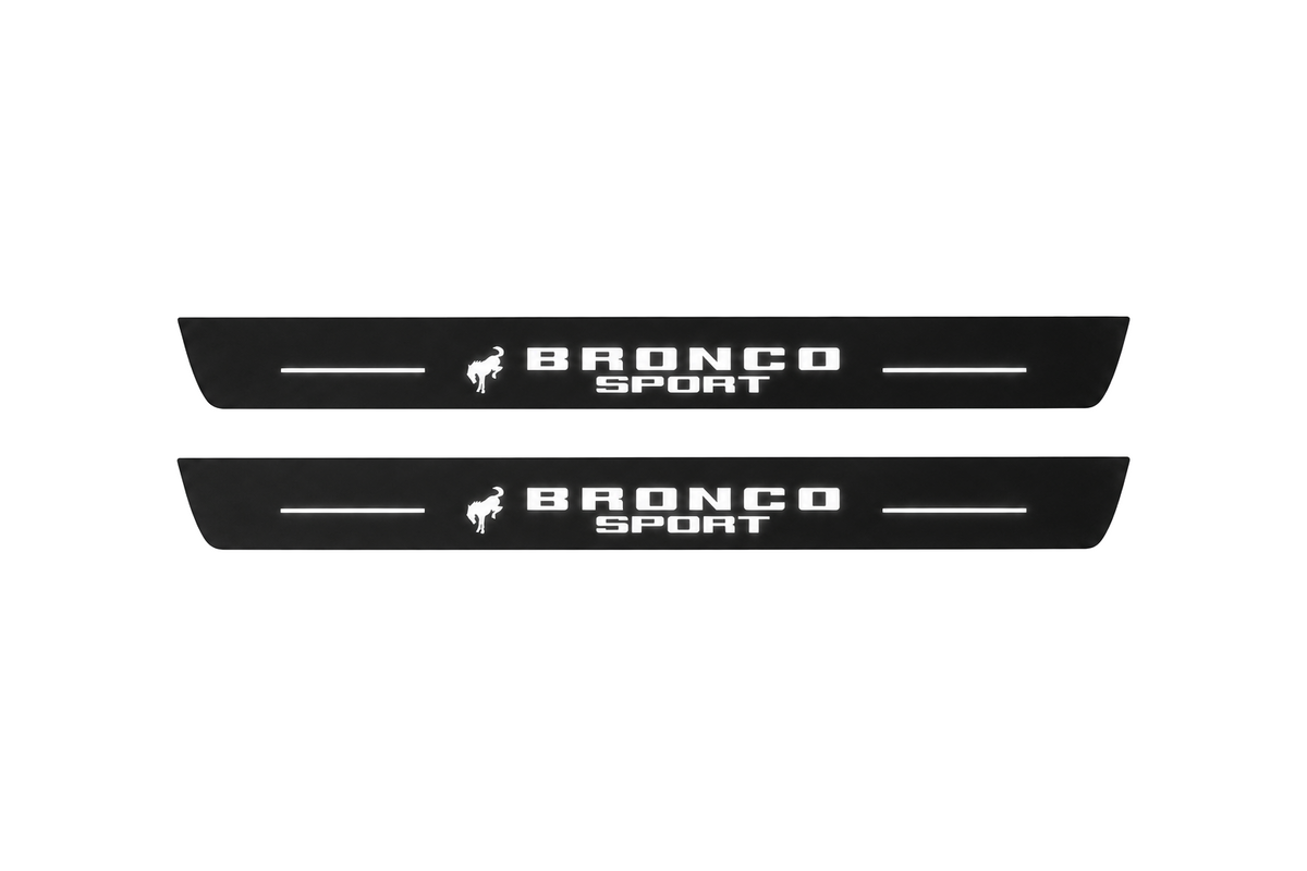 Catalogue illustration of two black Matte PRO front door sill plates with a small horse symbol and stacked illuminated BRONCO SPORT lettering on the top surface. Rear plates are not pictured; dimensions are selected for the vehicle during manufacture.