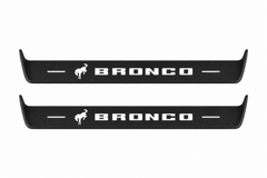 Catalogue illustration showing 2 black Matte PRO LED door sill plates with white Bronco lettering for Ford Bronco U725; dimensions are selected during manufacture.