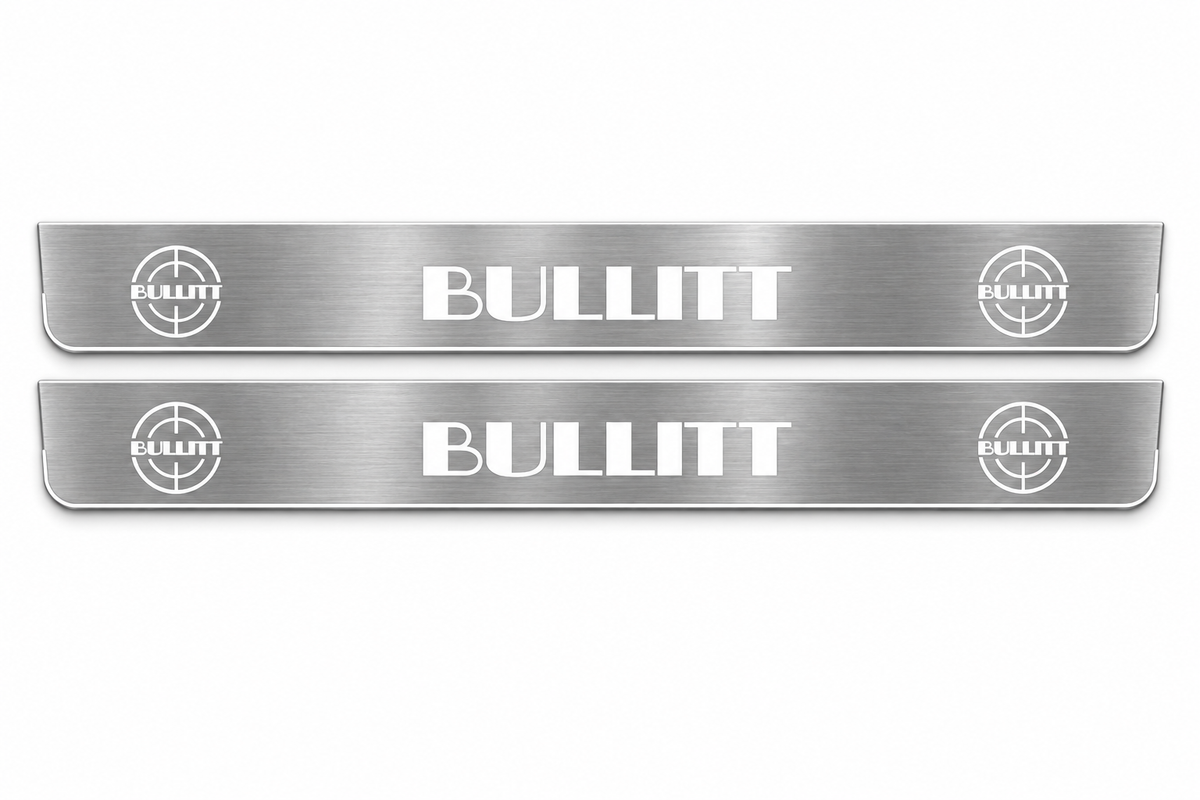 Product visualization: two flat bullitt-large-targets Stainless front plates with original source lettering and white LED zones flat brushed stainless steel door sill plates with white LED artwork and edges, white background.