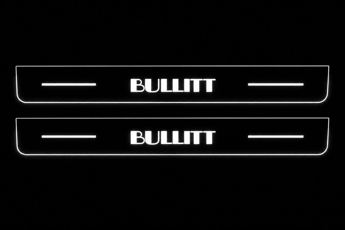 Product visualization: Exact BULLITT original glyphs and two flat source plates; nearly invisible black metal face flat brushed stainless steel door sill plates with white LED artwork and edges, dark background.