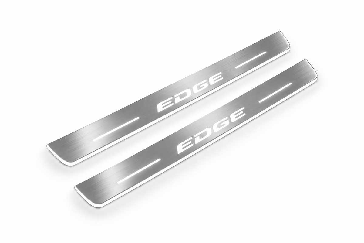Product visualization: EDGE exact source wordmark, two flat front plates flat brushed stainless steel door sill plates with white LED artwork and edges, white background.