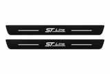 Catalogue illustration of two front black Matte PRO plates with illuminated ST Line lettering and horizontal top lines. Side edges are unlit; FRONT+REAR includes two rear plates not shown. Dimensions are selected for the Ford Escape CX482 during manufacture.