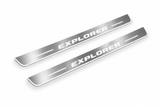Product visualization: explorer-u502 exact source artwork, two flat front plates flat brushed stainless steel door sill plates with white LED artwork and edges, white background.