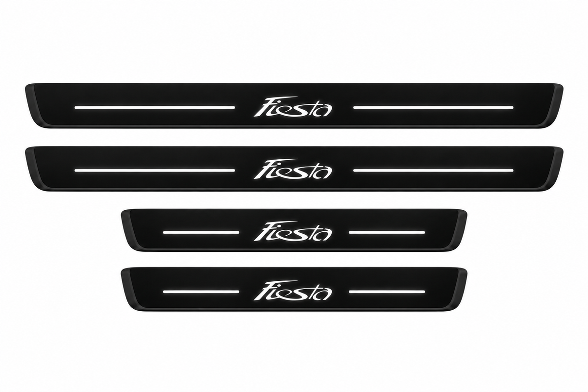 Catalogue illustration of two long front and two shorter rear black Matte PRO door sill plates with illuminated stylized Fiesta lettering and two straight top lines; side and lower edges are unlit. Exact B299 dimensions are selected for the vehicle.