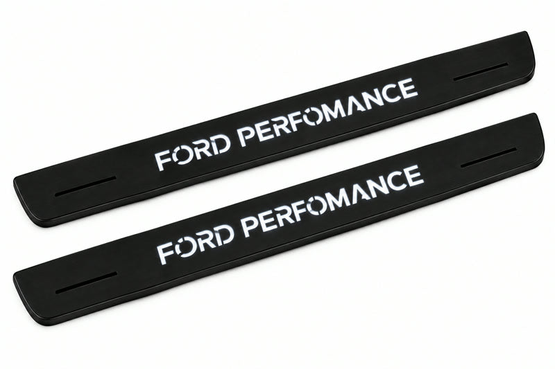 Catalogue illustration of two front black Matte PRO LED door sill plates with illuminated Ford Performance lettering for Ford Focus C346; dimensions are selected during manufacture.