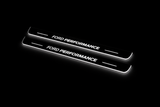 Product visualization: focus-c346-performance exact source artwork, two flat front plates flat brushed stainless steel door sill plates with white LED artwork and edges, dark background.