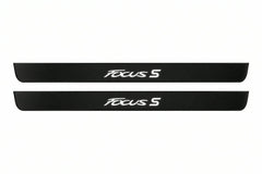 Catalogue illustration of two front black Matte PRO LED door sill plates with illuminated Focus S lettering for Ford Focus Estate C346; dimensions are selected during manufacture.