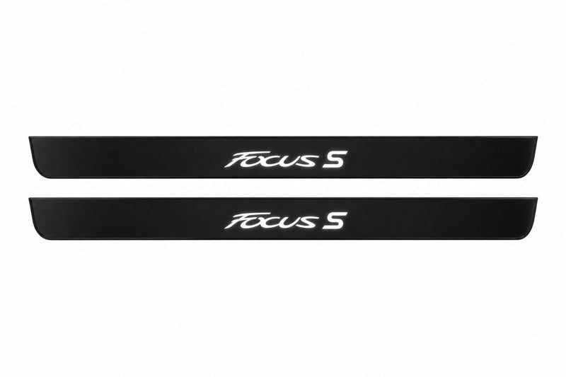 Catalogue illustration of two front black Matte PRO LED door sill plates with illuminated Focus S lettering for Ford Focus Estate C346; dimensions are selected during manufacture.