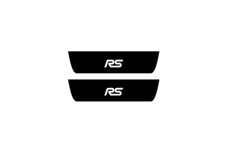 Catalog illustration of two black rear door sill plates with RS lettering.
