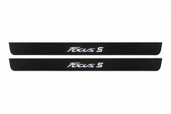Catalogue illustration of two front black Matte PRO LED door sill plates with illuminated Focus S lettering for Ford Focus III C346; dimensions are selected during manufacture.