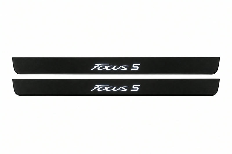 Catalogue illustration of two front black Matte PRO LED door sill plates with illuminated Focus S lettering for Ford Focus III C346; dimensions are selected during manufacture.