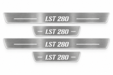 Product visualization: four Ford Focus LST280 FRONT+REAR flat brushed stainless steel door sill plates with white LED artwork and edges, white background.