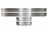 Product visualization: four original flat Focus S sill plates, two front with bars and two shorter rear without bars flat brushed stainless steel door sill plates with white LED artwork and edges, white background.