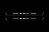 Product visualization: two flat long front plates with original squared FUSION lettering, side bars and Stainless edge LEDs; outline checked against saved exact material pair flat brushed stainless steel door sill plates with white LED artwork and edges, dark background.